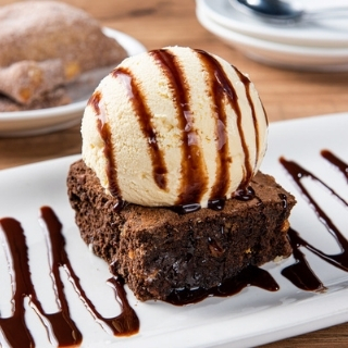 Border Brownie Sundae: Rich chocolate & walnut brownie topped with vanilla ice cream and a chocolate sauce drizzle. Feeds up to four.