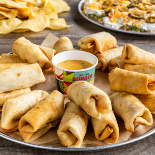 Mini Chimichanga Platter: 24 seasoned ground beef or chicken tinga mini chimis. Served with signature queso.