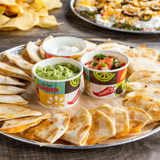 Mini Quesadilla Platter: 24 cheese, chicken or steak mini quesadillas. Served with sour cream, pico de gallo and guacamole.
